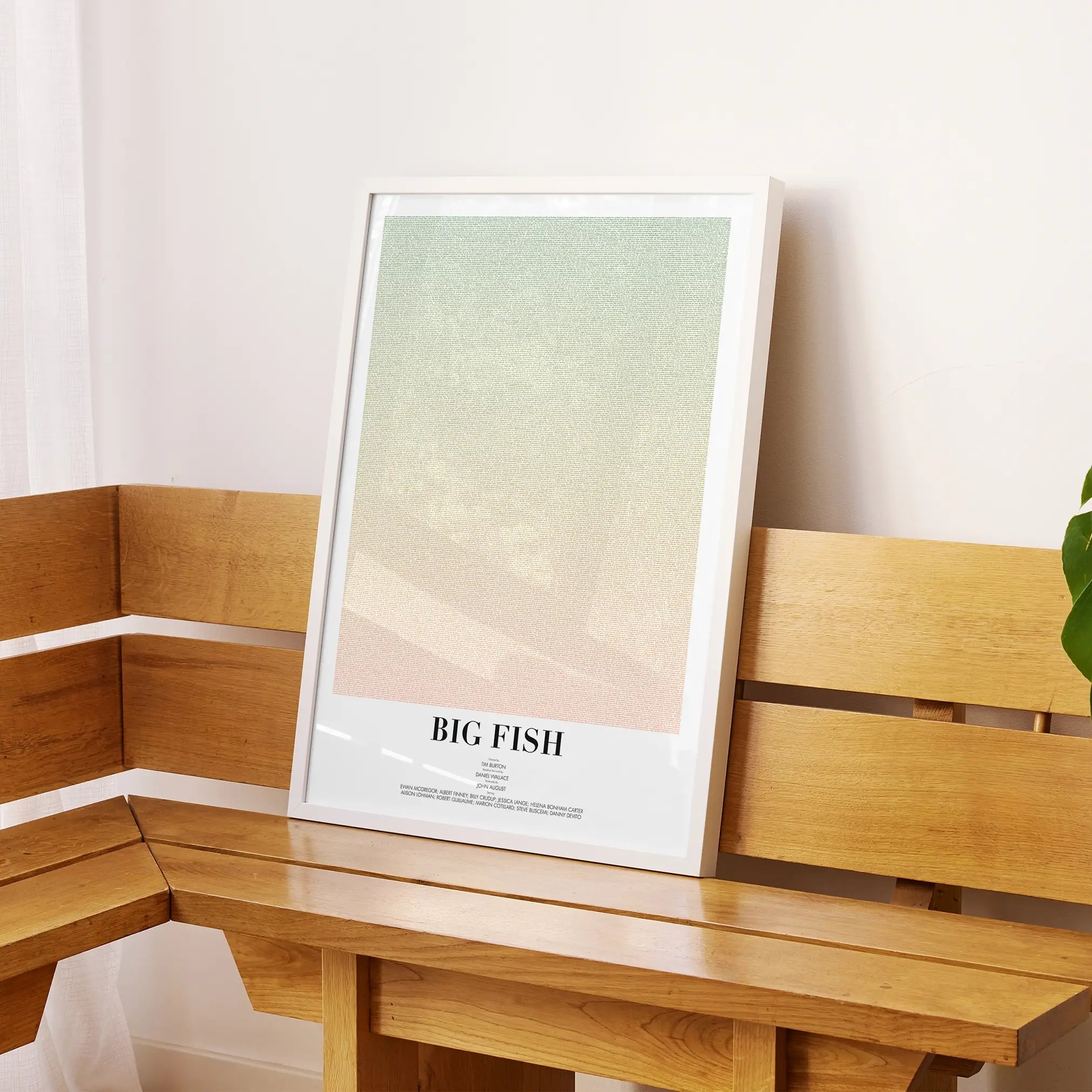 A framed Big Fish movie script poster displayed on a sideboard in a contemporary space.