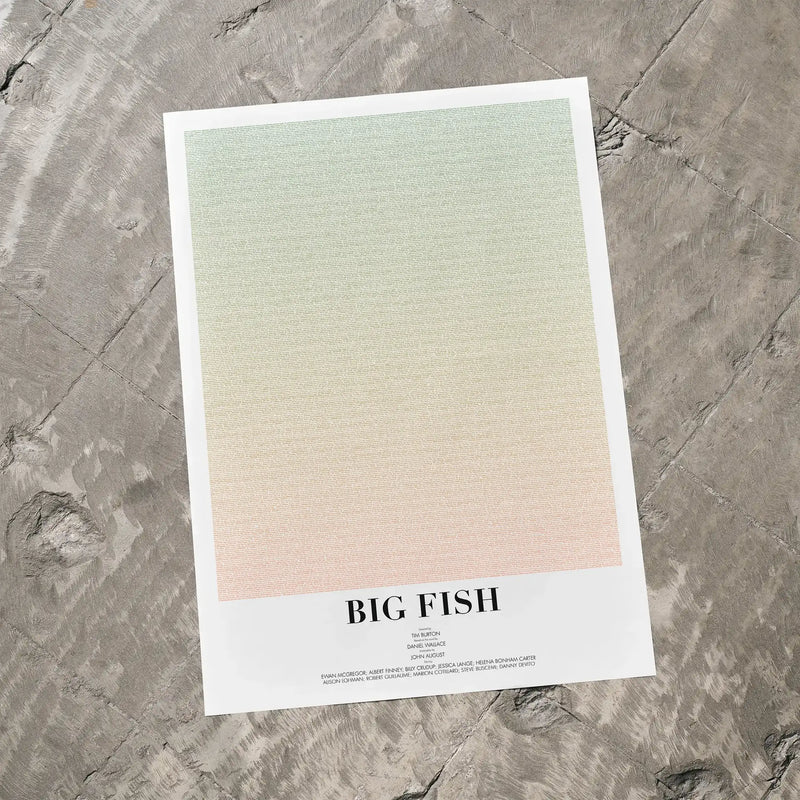 A Big Fish movie script poster laid flat on a textured floor surface.