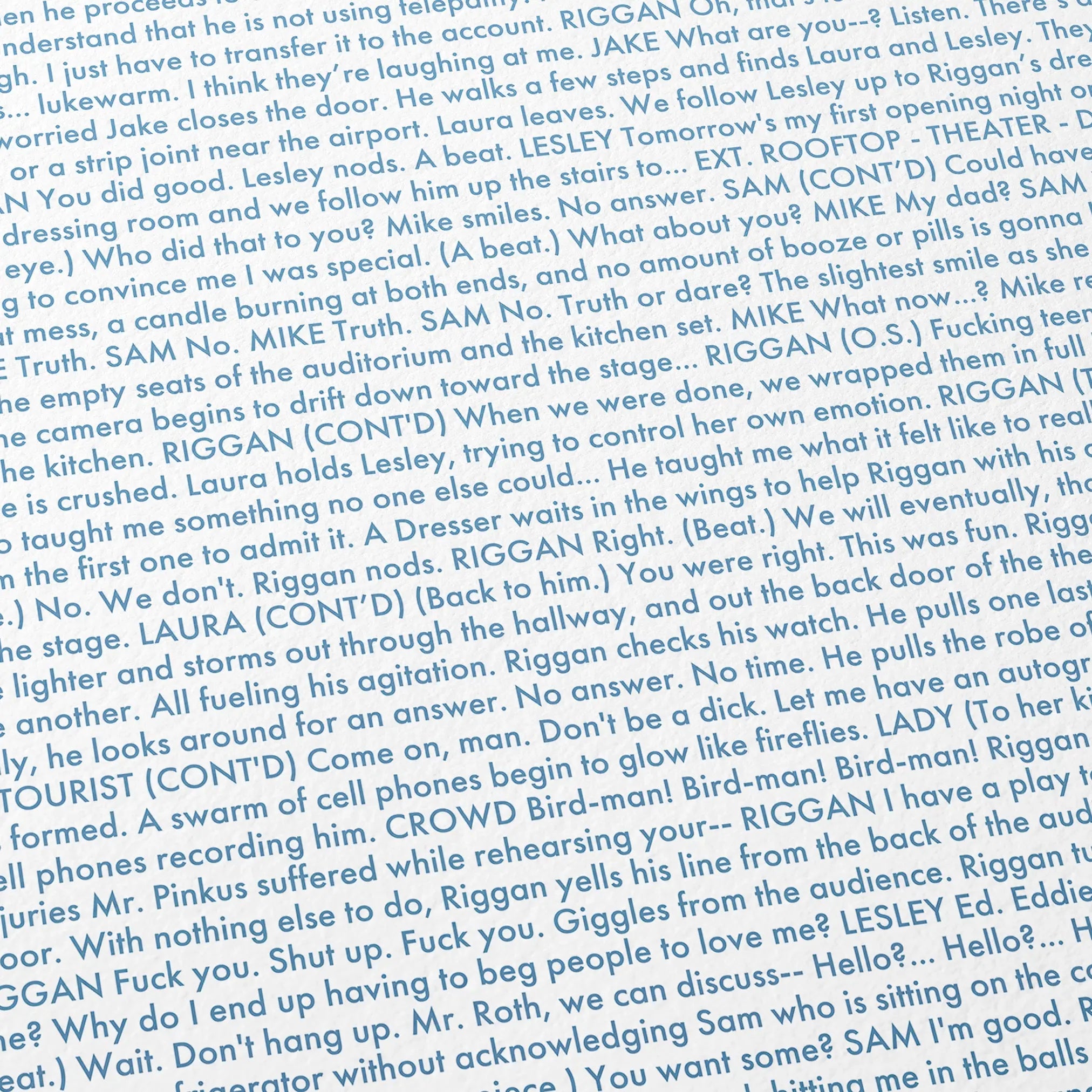Close-up detail of the Birdman or movie script poster showing dense typographic text.