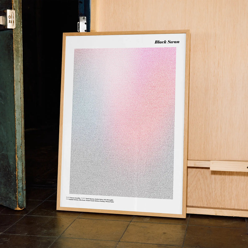 A framed Black Swan movie script poster displayed in a contemporary interior setting.