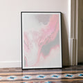A framed Black Swan movie script poster leaning against a wall in a minimalist interior.