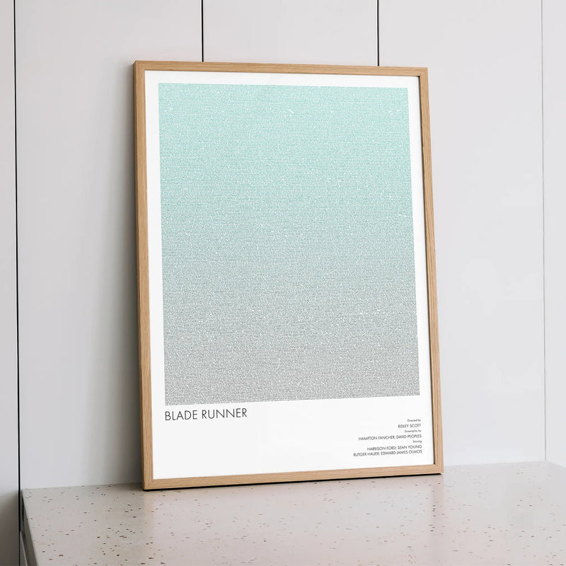 A framed Blade Runner movie script poster styled within a calm interior space.