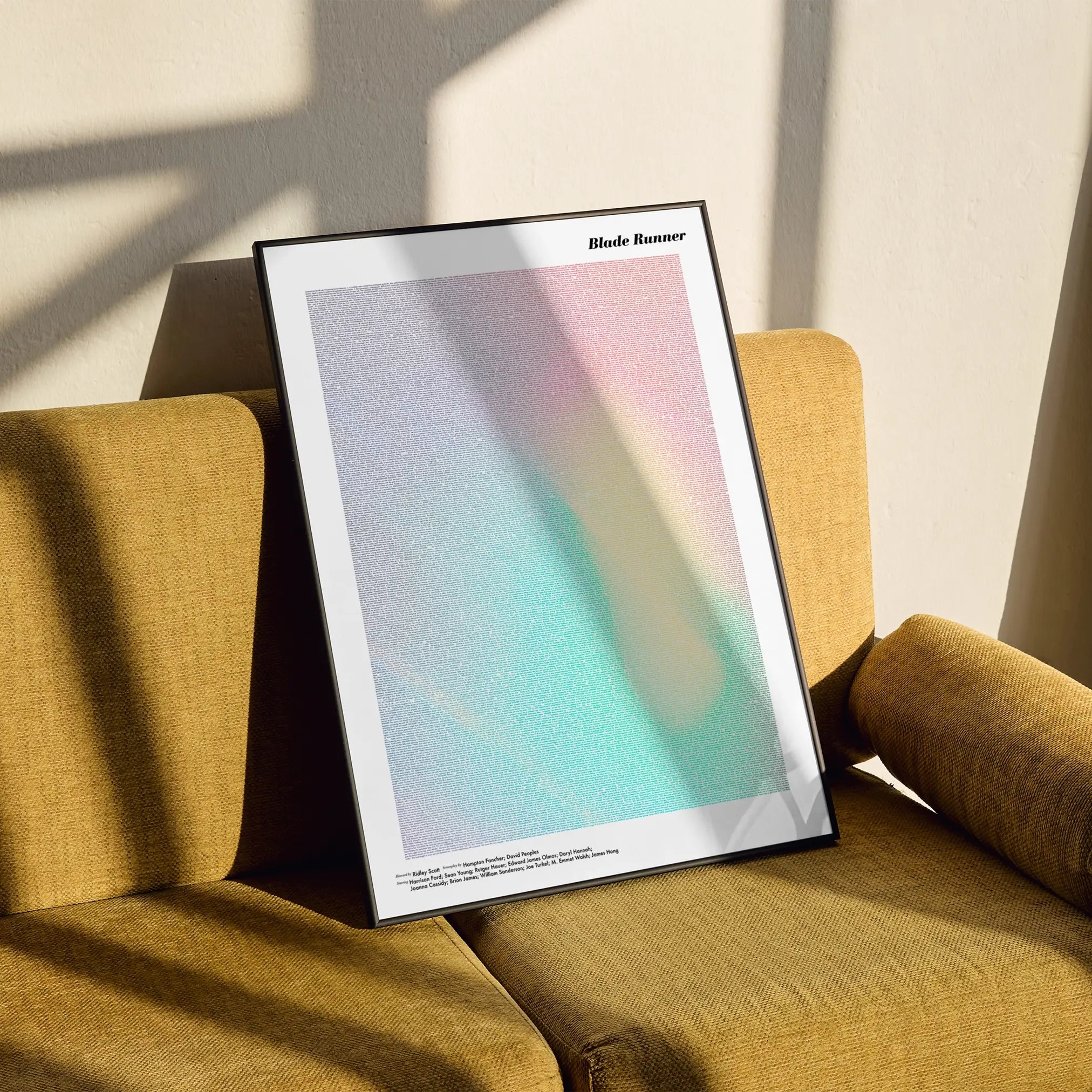 A framed Blade Runner movie script poster styled in a clean interior setting.