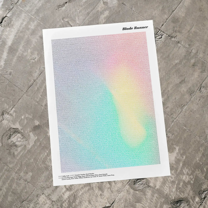 A Blade Runner movie script poster laid flat on a textured floor surface.