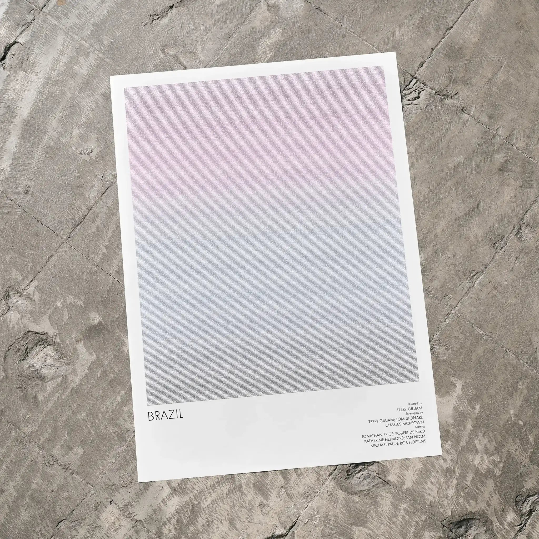 A Brazil movie script poster laid flat on a textured floor surface.