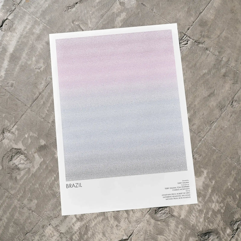 A Brazil movie script poster laid flat on a textured floor surface.