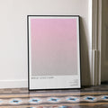 A framed Bridget Jones's Diary movie script poster leaning against a wall in a minimalist interior.