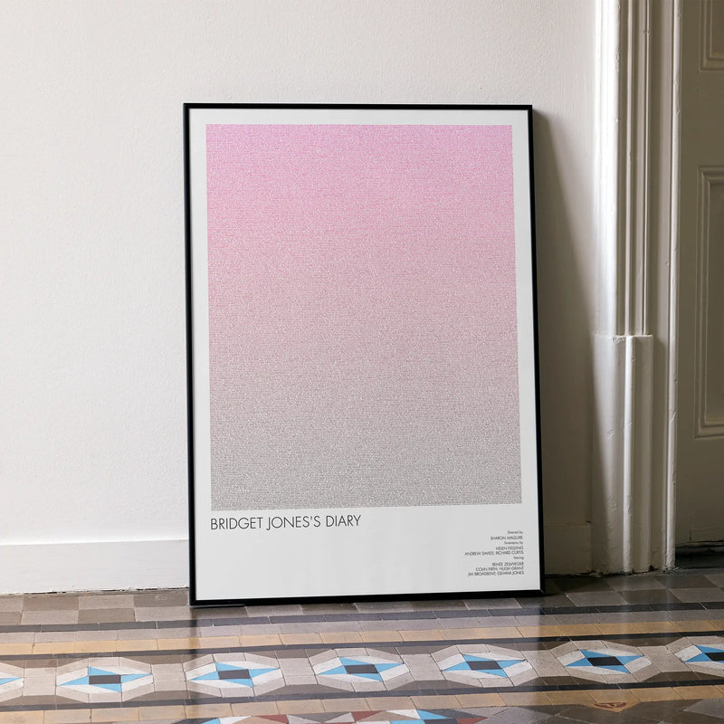 A framed Bridget Jones's Diary movie script poster leaning against a wall in a minimalist interior.