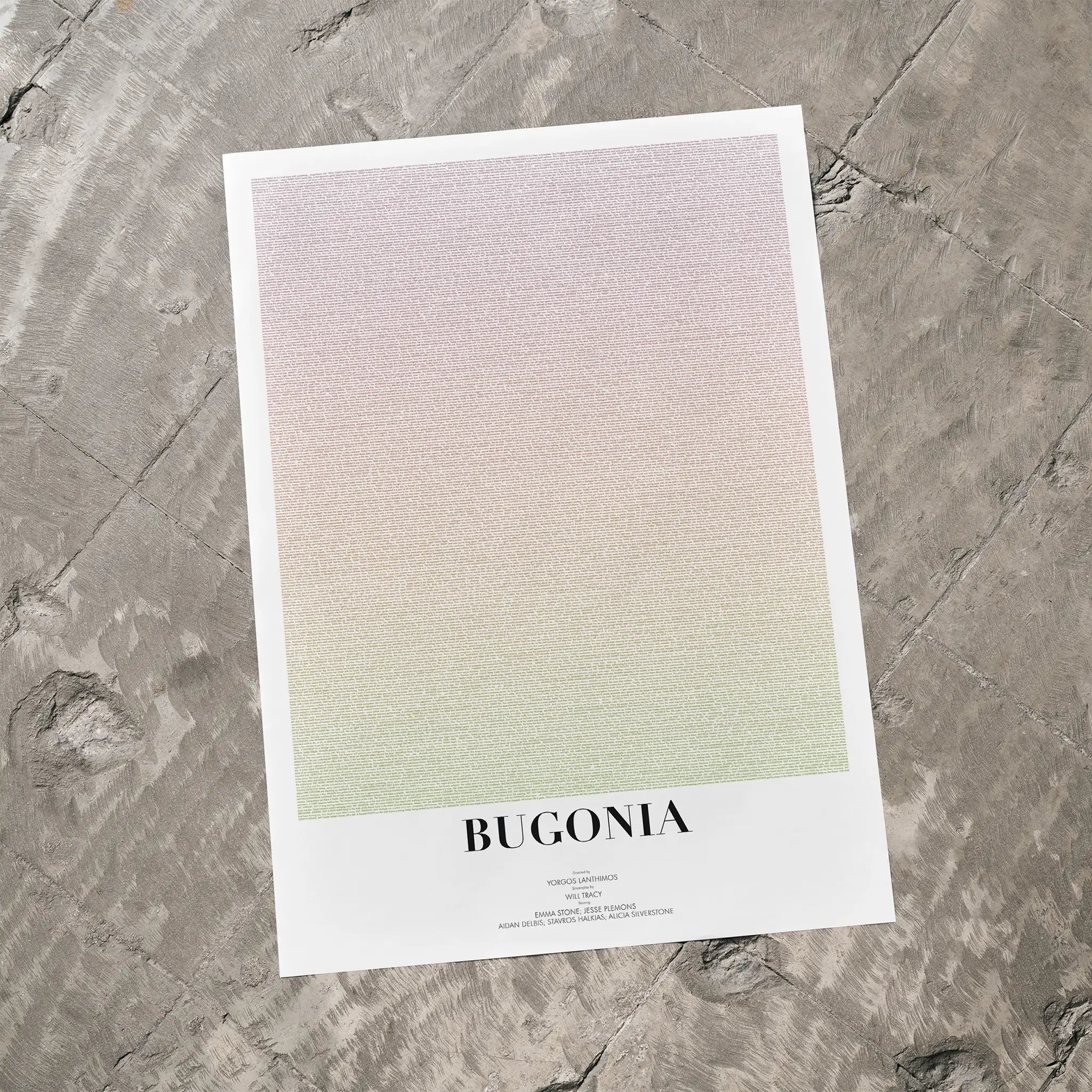 A Bugonia movie script poster laid flat on a textured floor surface.