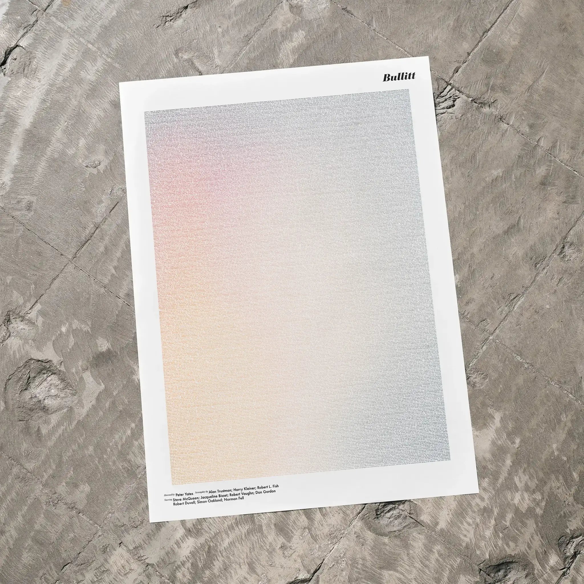 A Bullitt movie script poster laid flat on a textured floor surface.