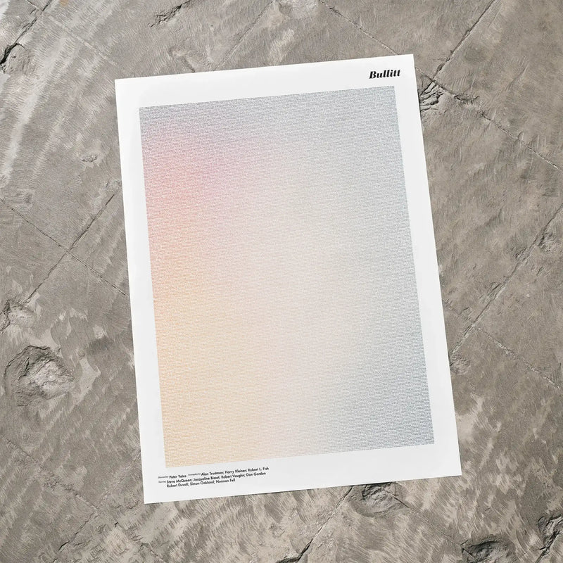 A Bullitt movie script poster laid flat on a textured floor surface.