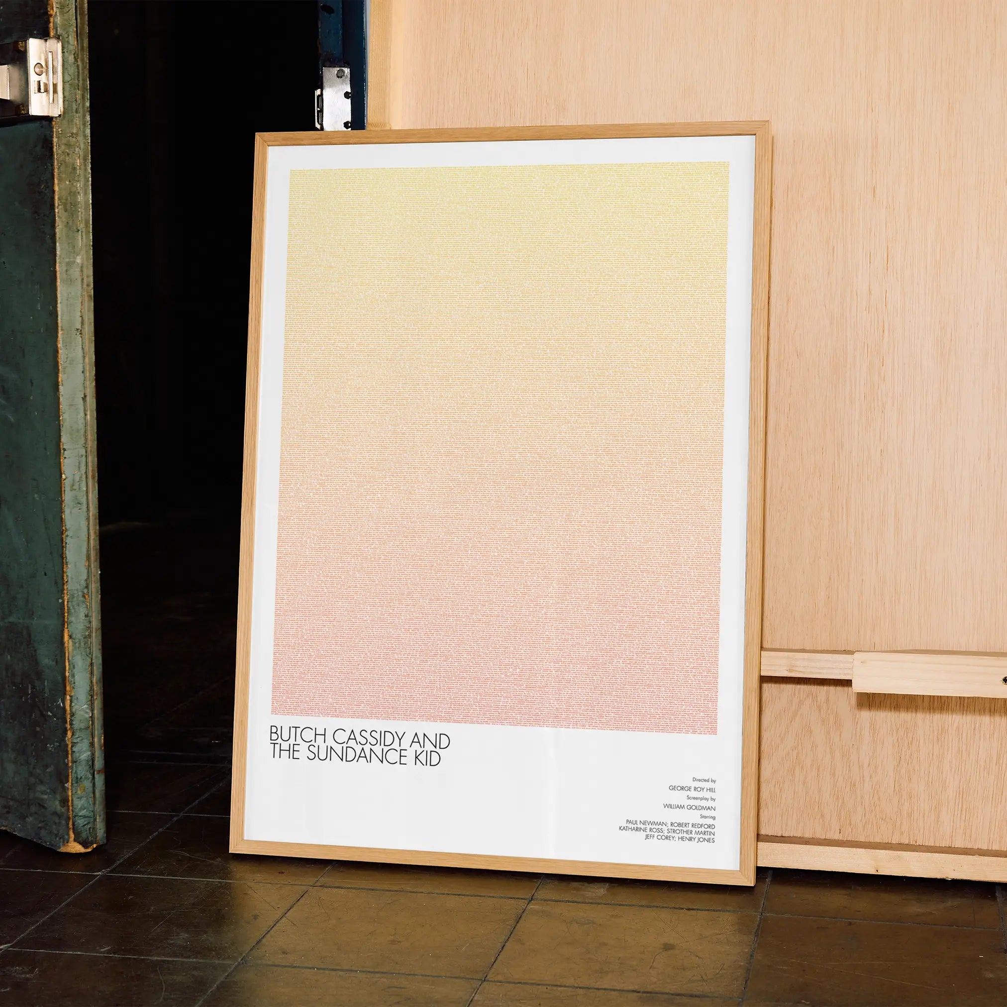 A framed Butch Cassidy and the Sundance Kid movie script poster displayed in a contemporary interior setting.