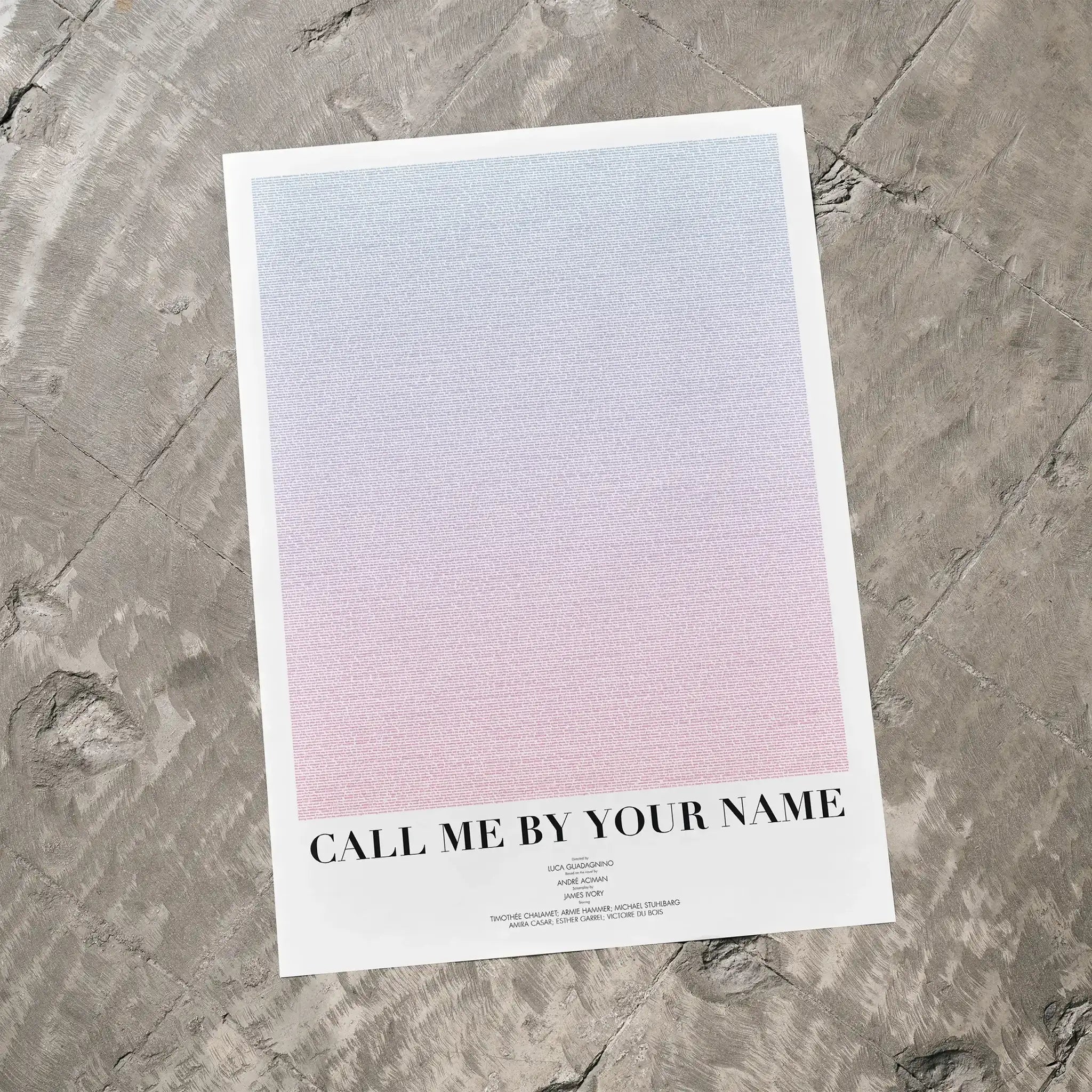 A Call Me by Your Name movie script poster laid flat on a textured floor surface.