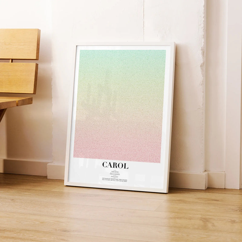 A framed Carol movie script poster leaning against a wall in a modern interior.