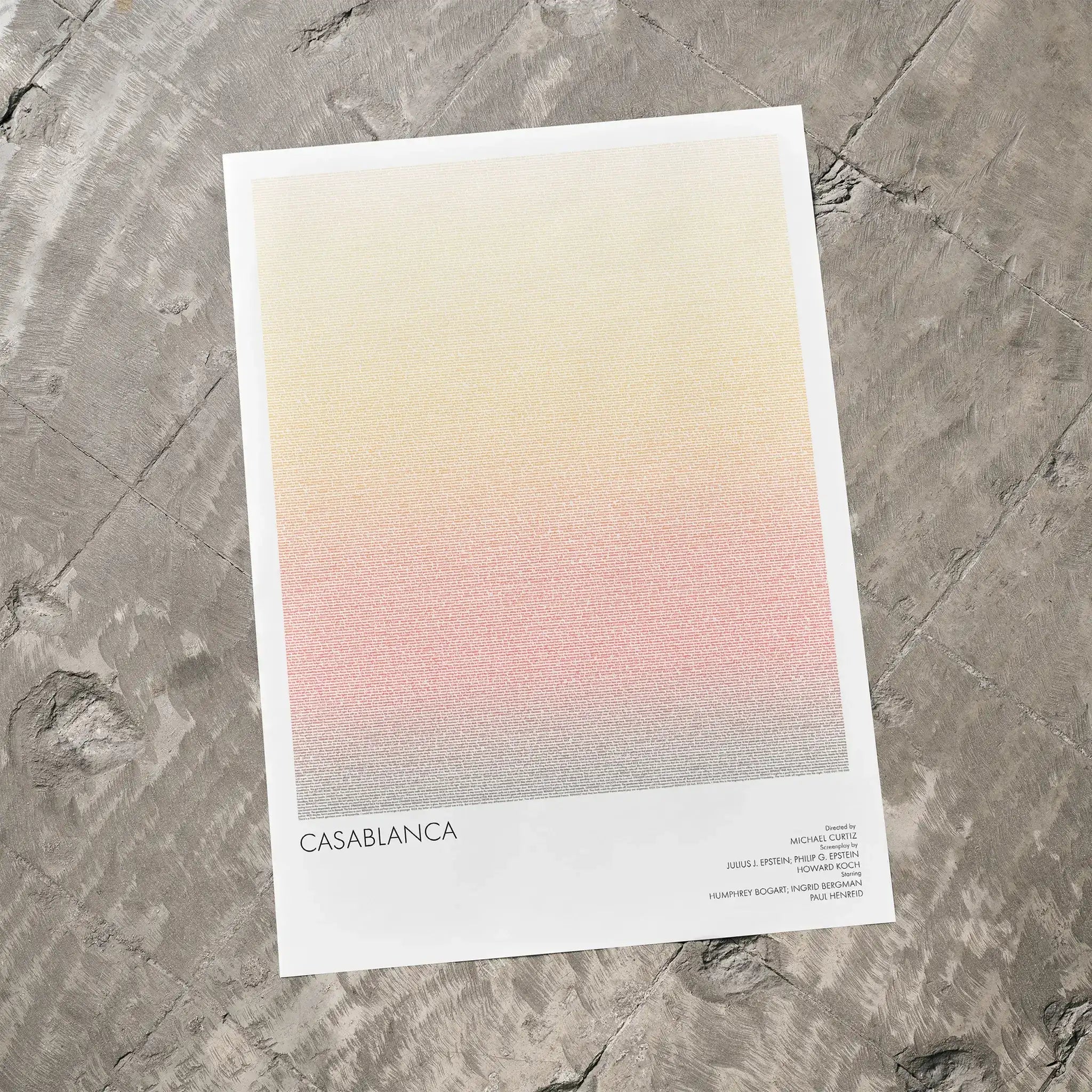 A Casablanca movie script poster laid flat on a textured floor surface.