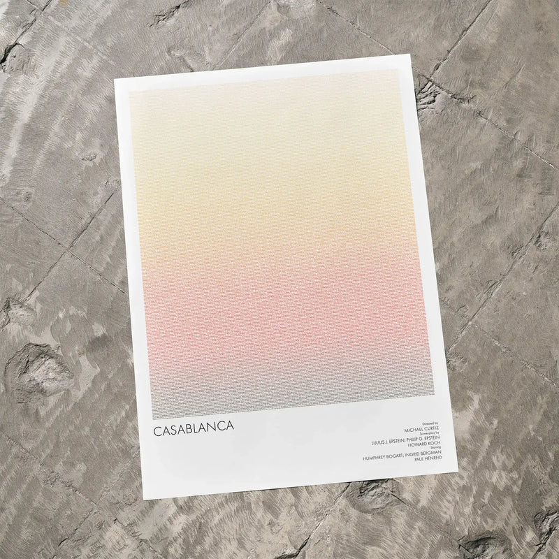 A Casablanca movie script poster laid flat on a textured floor surface.