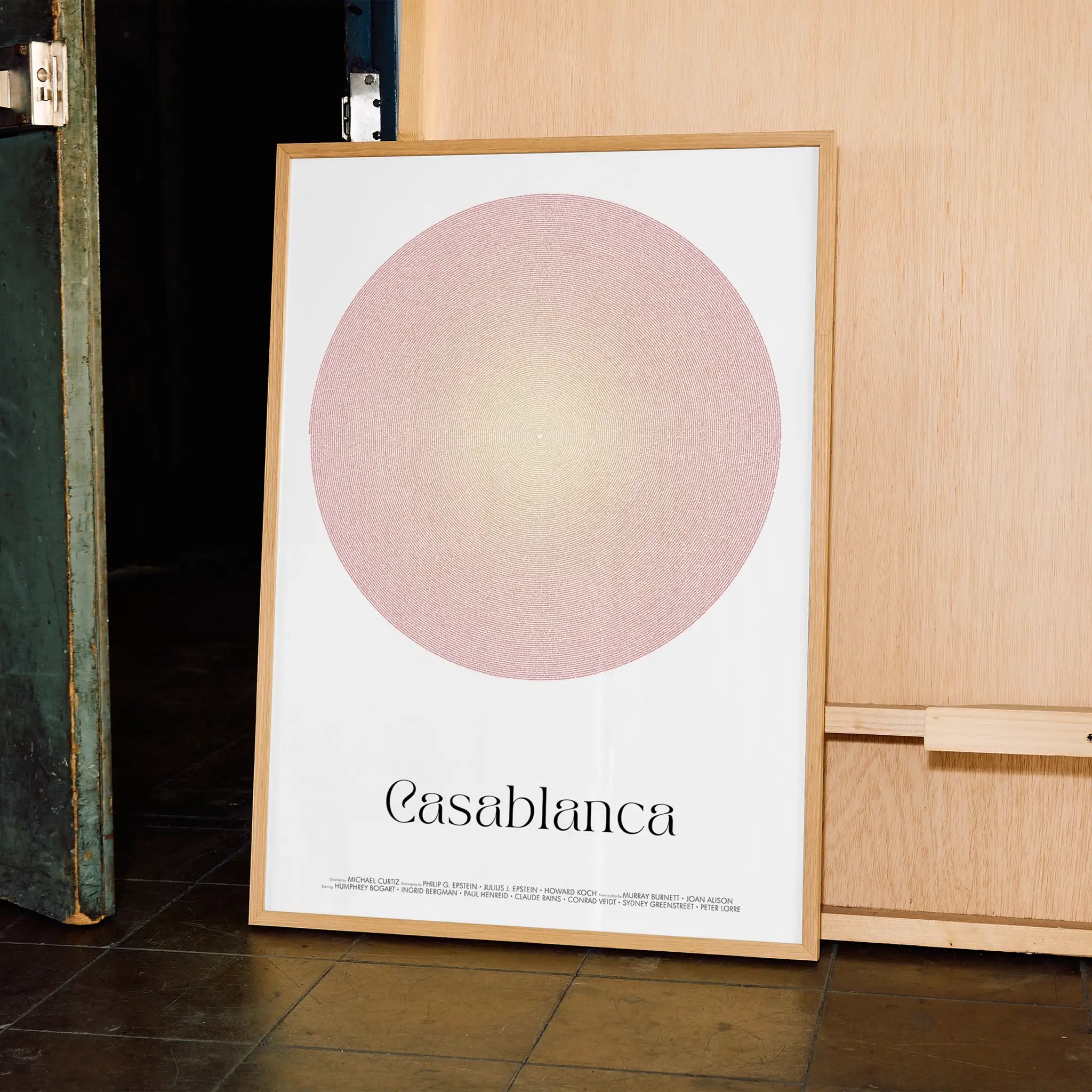 A framed Casablanca movie script poster displayed in a contemporary interior setting.