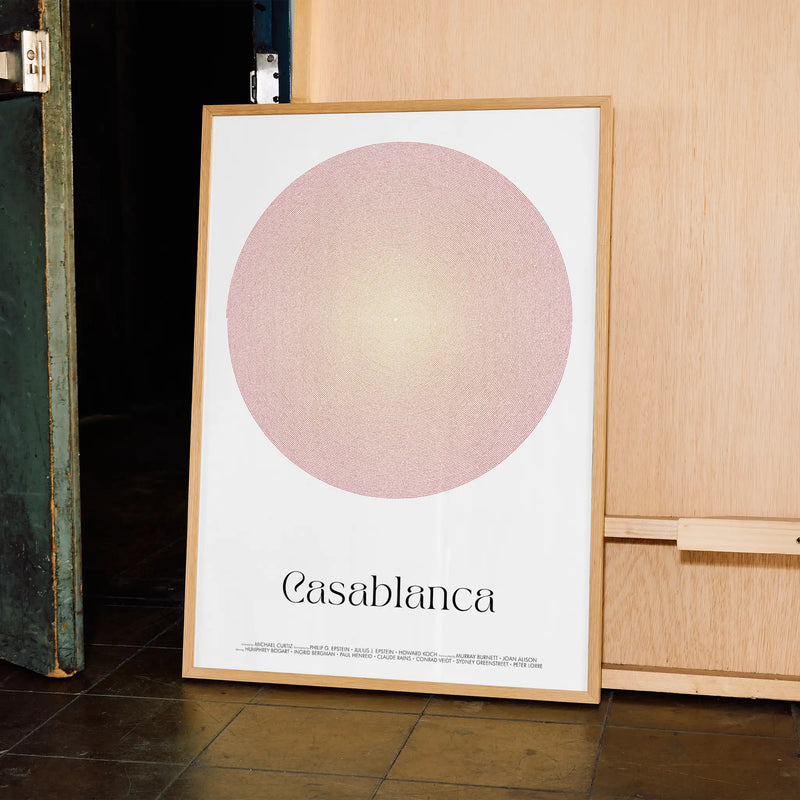 A framed Casablanca movie script poster displayed in a contemporary interior setting.