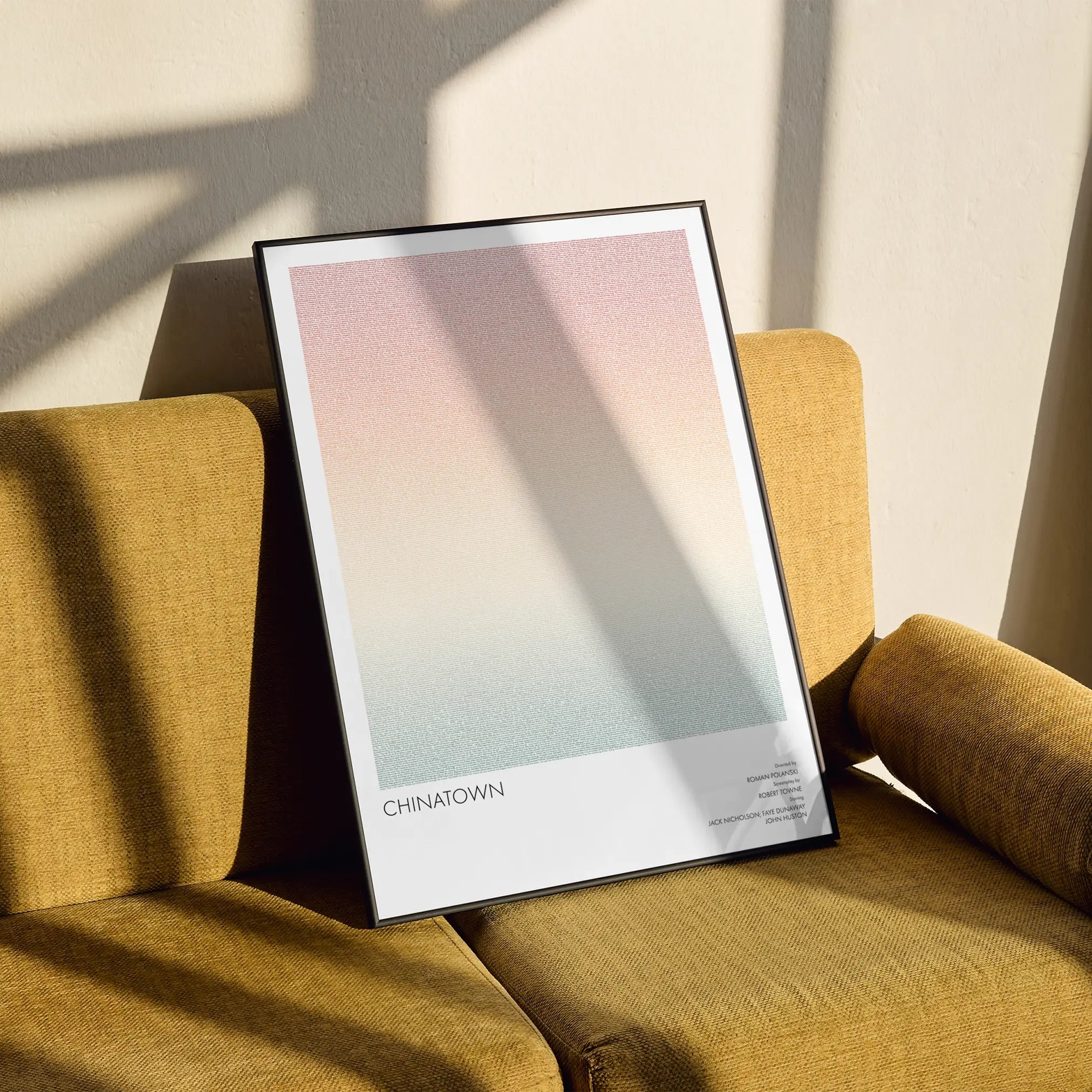 A framed Chinatown movie script poster styled in a clean interior setting.