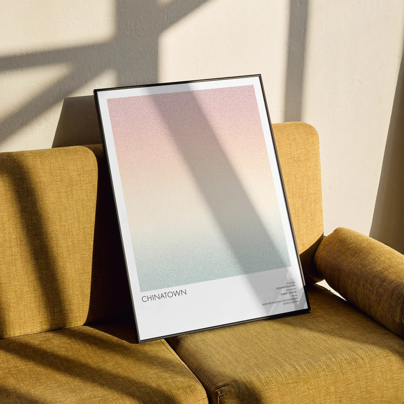 A framed Chinatown movie script poster styled in a clean interior setting.