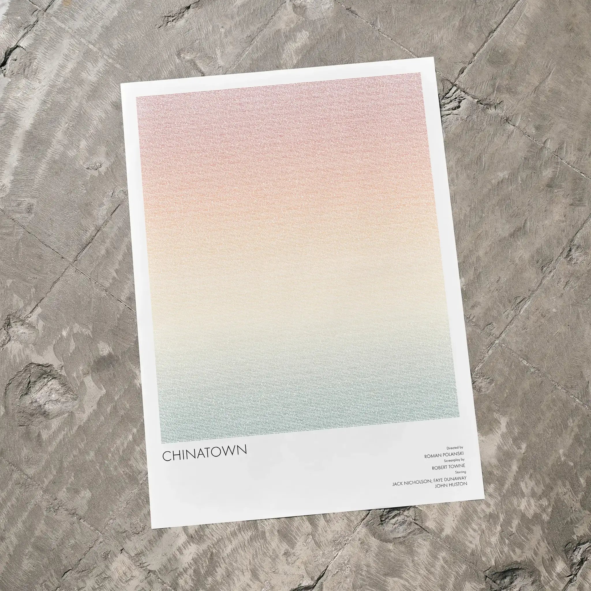 A Chinatown movie script poster laid flat on a textured floor surface.