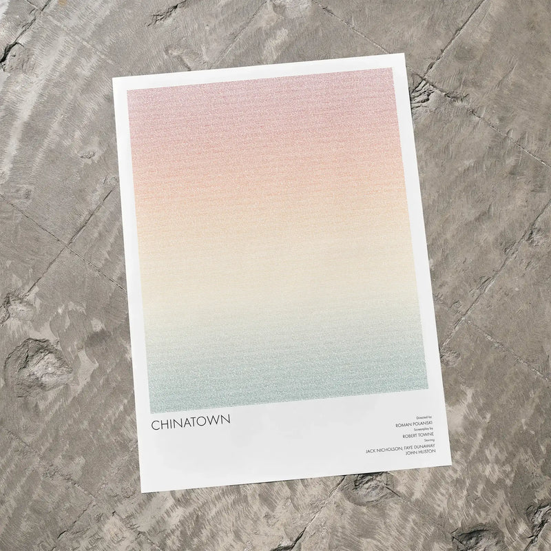 A Chinatown movie script poster laid flat on a textured floor surface.
