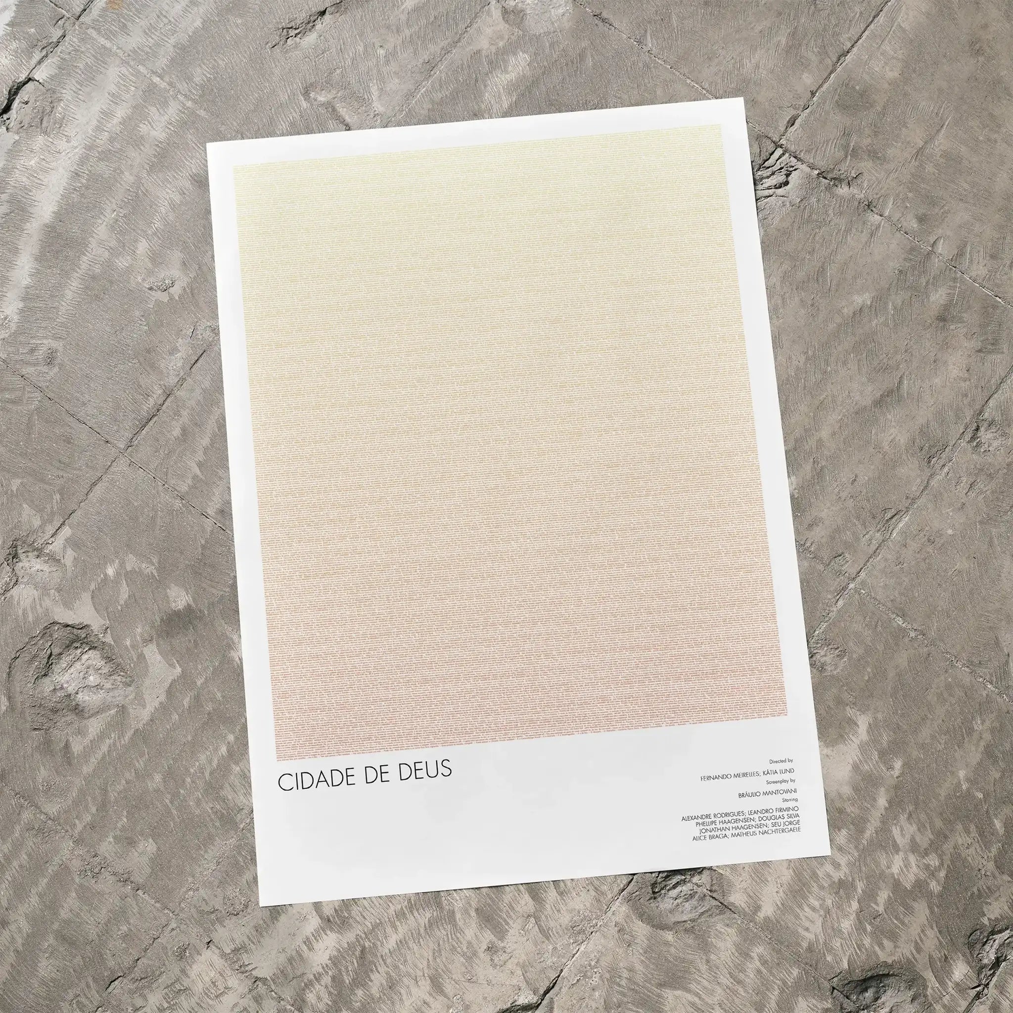 A Cidade de Deus movie script poster laid flat on a textured floor surface.