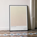 A framed Cidade de Deus movie script poster leaning against a wall in a minimalist interior.