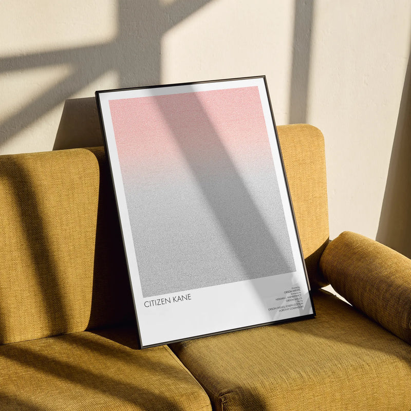 A framed Citizen Kane movie script poster styled in a clean interior setting.