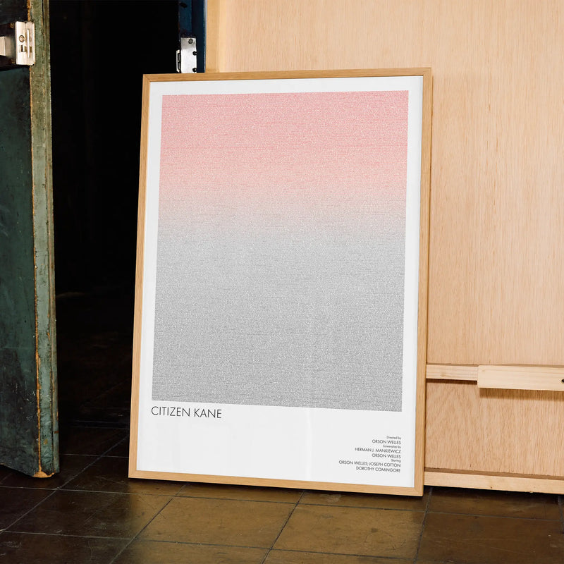 A framed Citizen Kane movie script poster displayed in a contemporary interior setting.