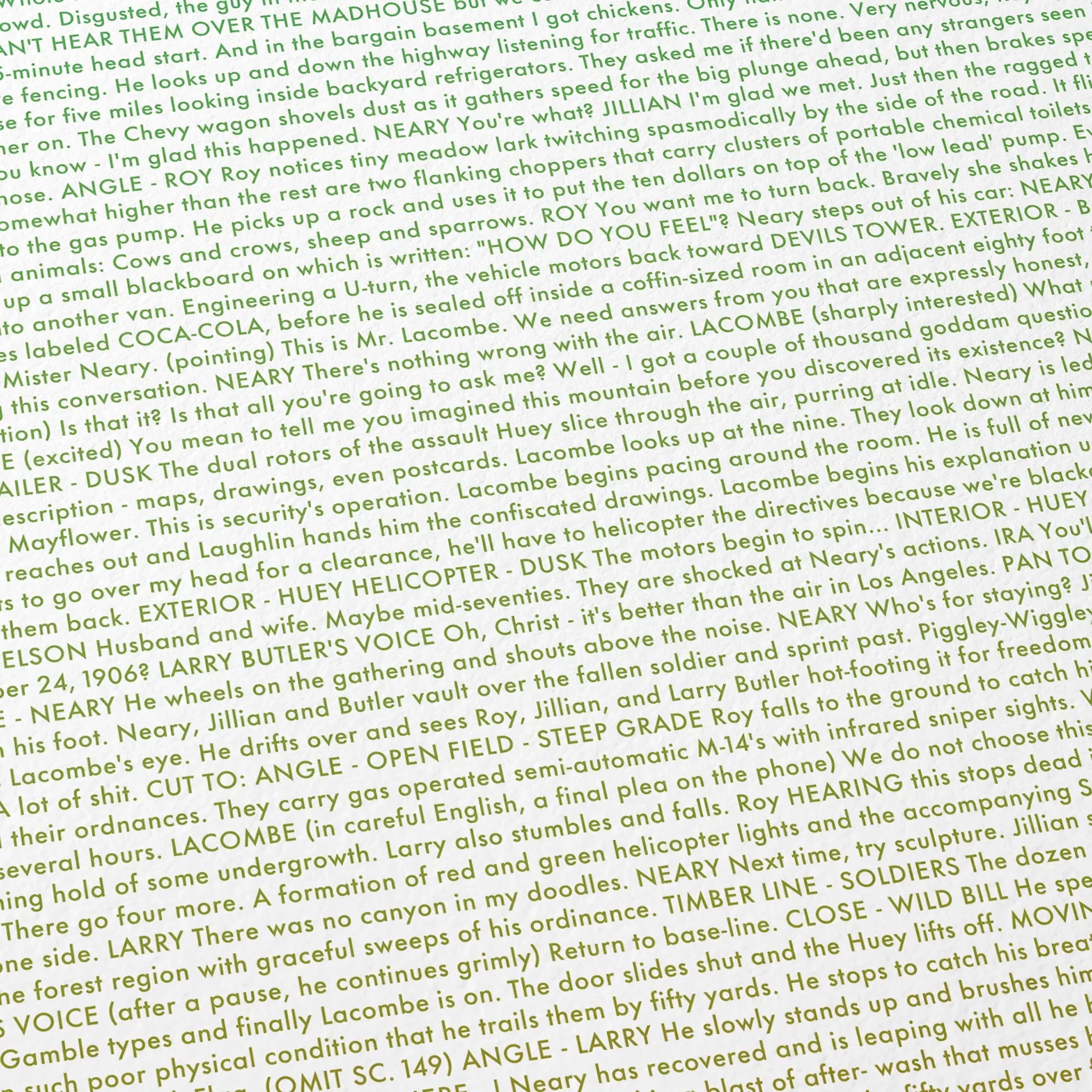 Close-up detail of the Close Encounters of the Third Kind movie script poster showing dense typographic text.