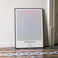 A framed Contact movie script poster leaning against a wall in a minimalist interior.