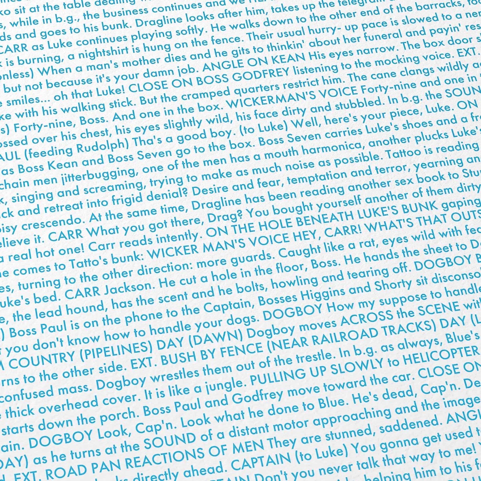 Close-up detail of the Cool Hand Luke movie script poster showing dense typographic text.