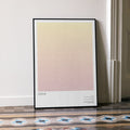 A framed Crank movie script poster leaning against a wall in a minimalist interior.