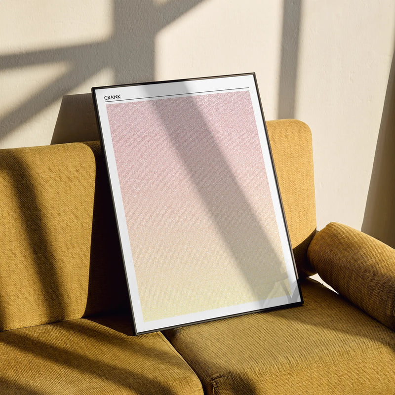A framed Crank movie script poster styled in a clean interior setting.