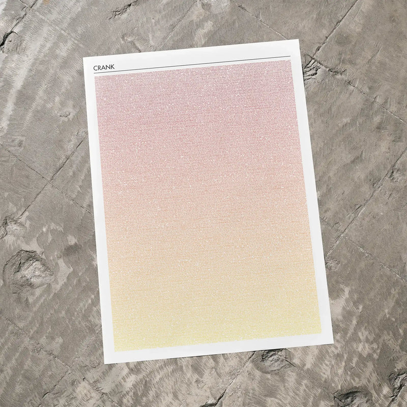 A Crank movie script poster laid flat on a textured floor surface.
