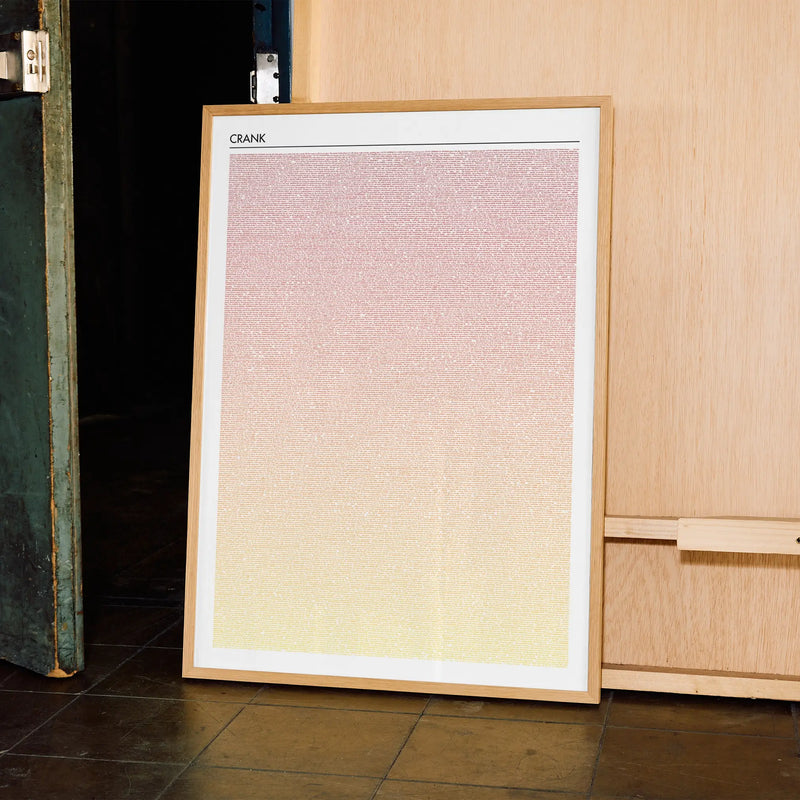 A framed Crank movie script poster displayed in a contemporary interior setting.