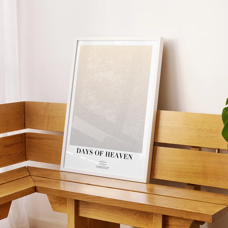 A framed Days of Heaven movie script poster displayed on a sideboard in a contemporary space.