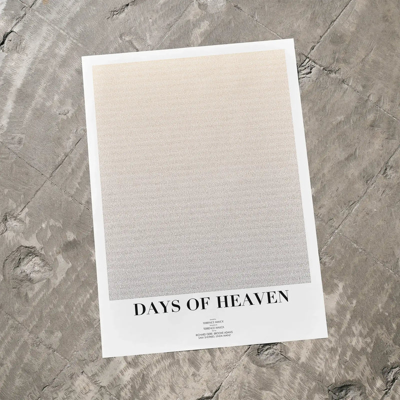 A Days of Heaven movie script poster laid flat on a textured floor surface.