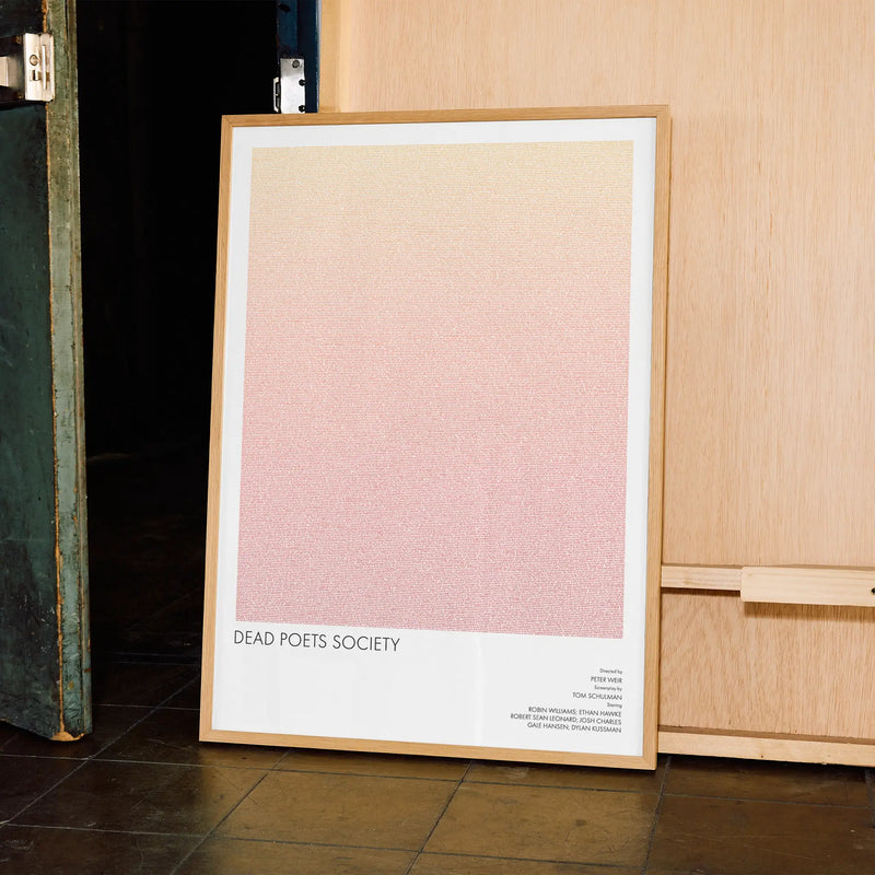 A framed Dead Poets Society movie script poster displayed in a contemporary interior setting.
