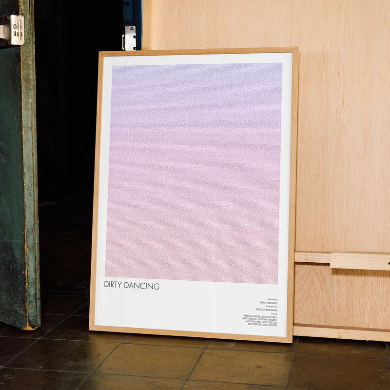 A framed Dirty Dancing movie script poster displayed in a contemporary interior setting.