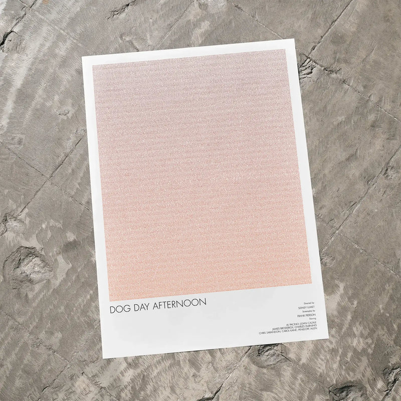 A Dog Day Afternoon movie script poster laid flat on a textured floor surface.