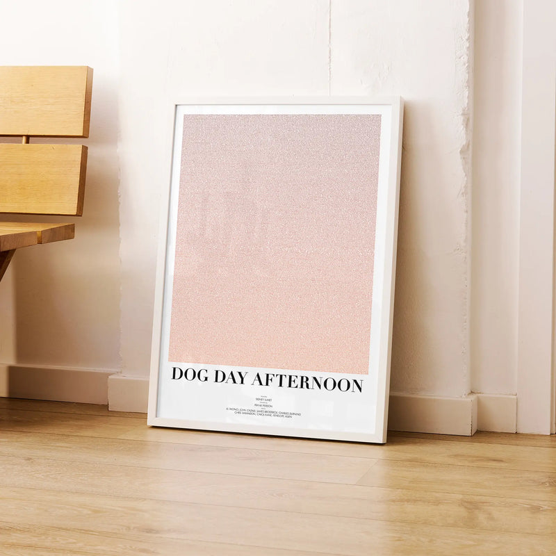 A framed Dog Day Afternoon movie script poster leaning against a wall in a modern interior.