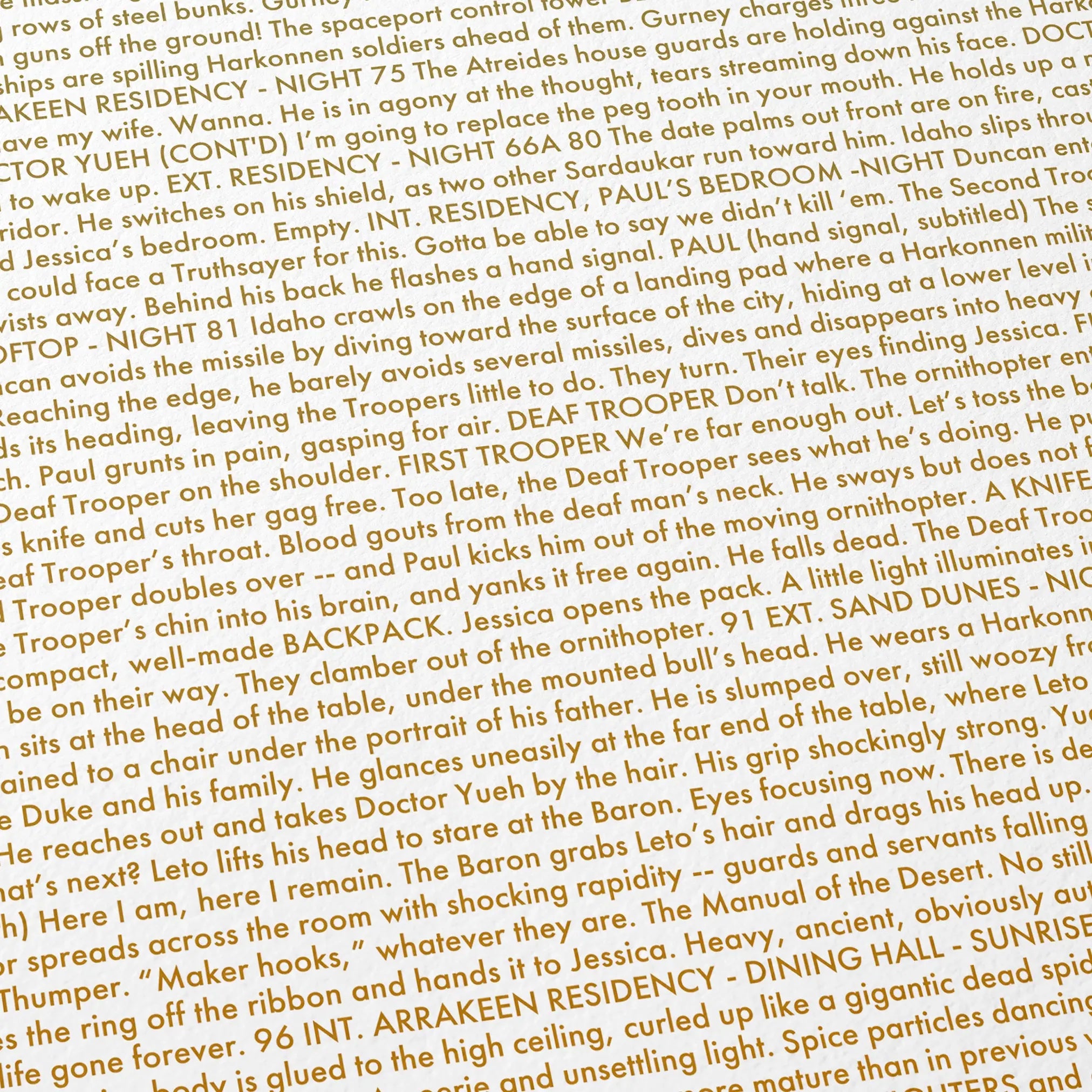 Close-up detail of the Dune movie script poster showing dense typographic text.