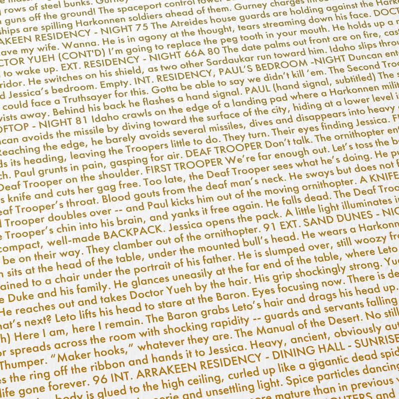 Close-up detail of the Dune movie script poster showing dense typographic text.
