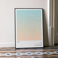 A framed Dune movie script poster leaning against a wall in a minimalist interior.