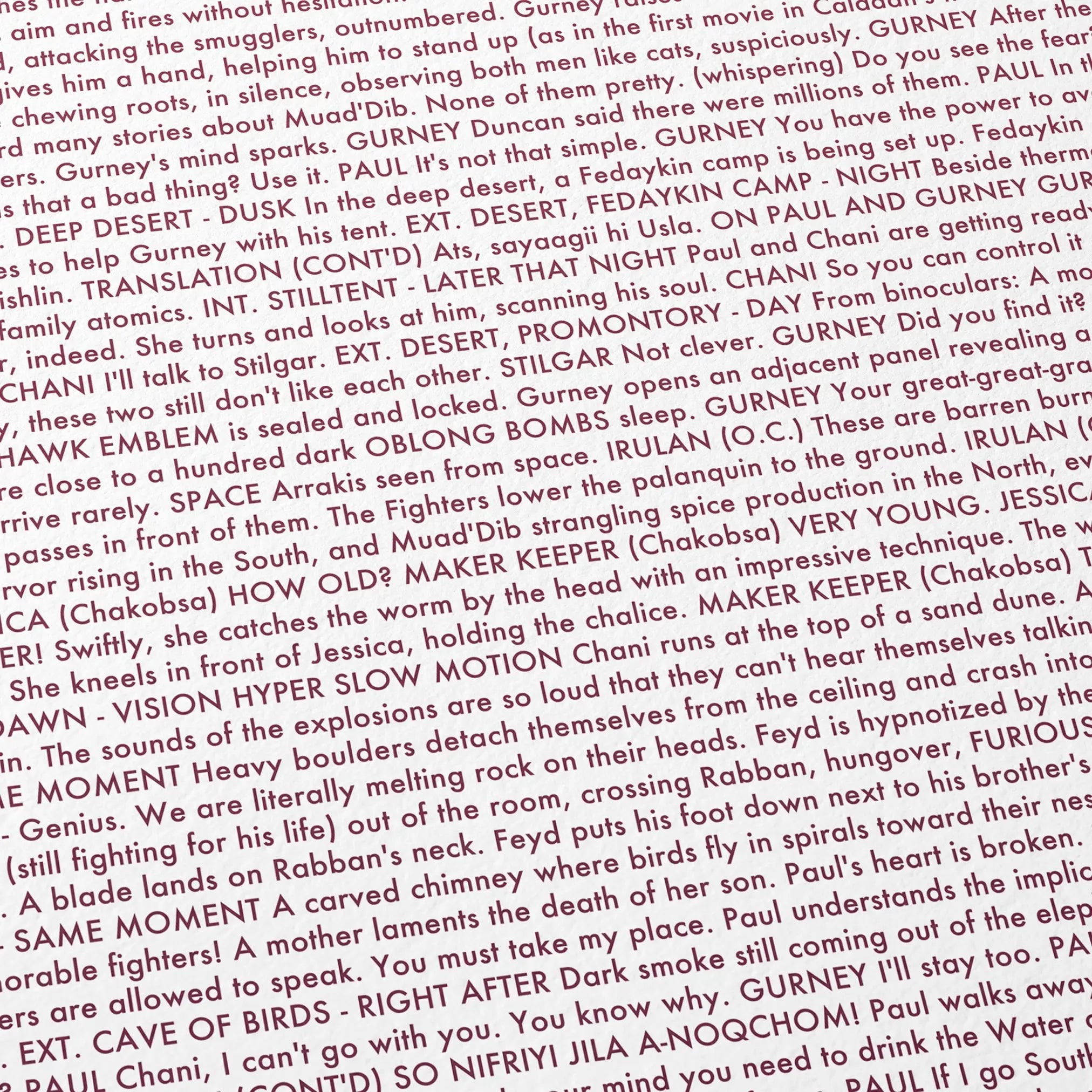 Close-up detail of the Dune: Part Two movie script poster showing dense typographic text.