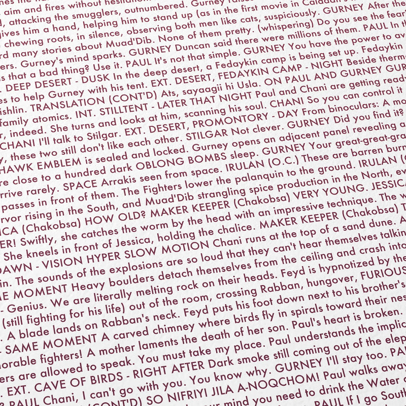 Close-up detail of the Dune: Part Two movie script poster showing dense typographic text.