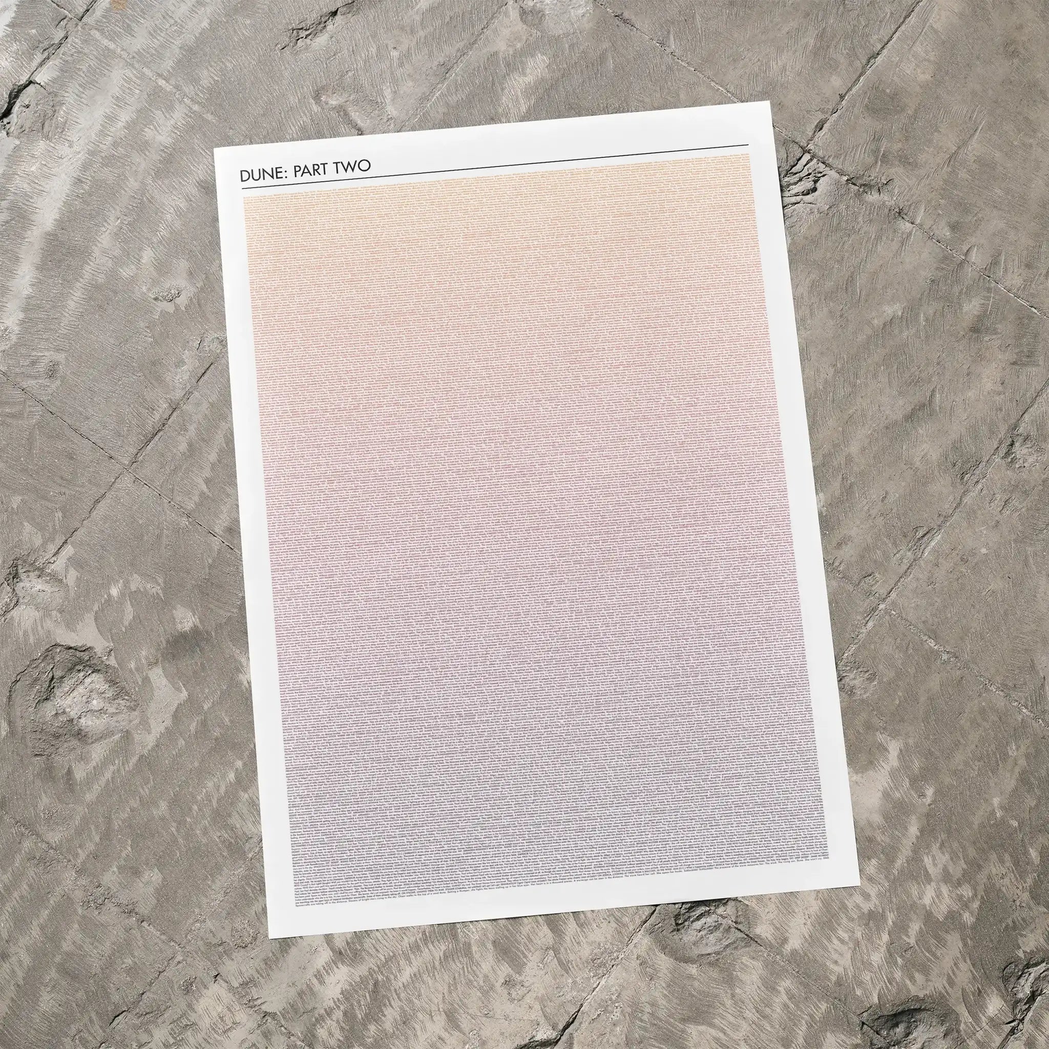A Dune: Part Two movie script poster laid flat on a textured floor surface.