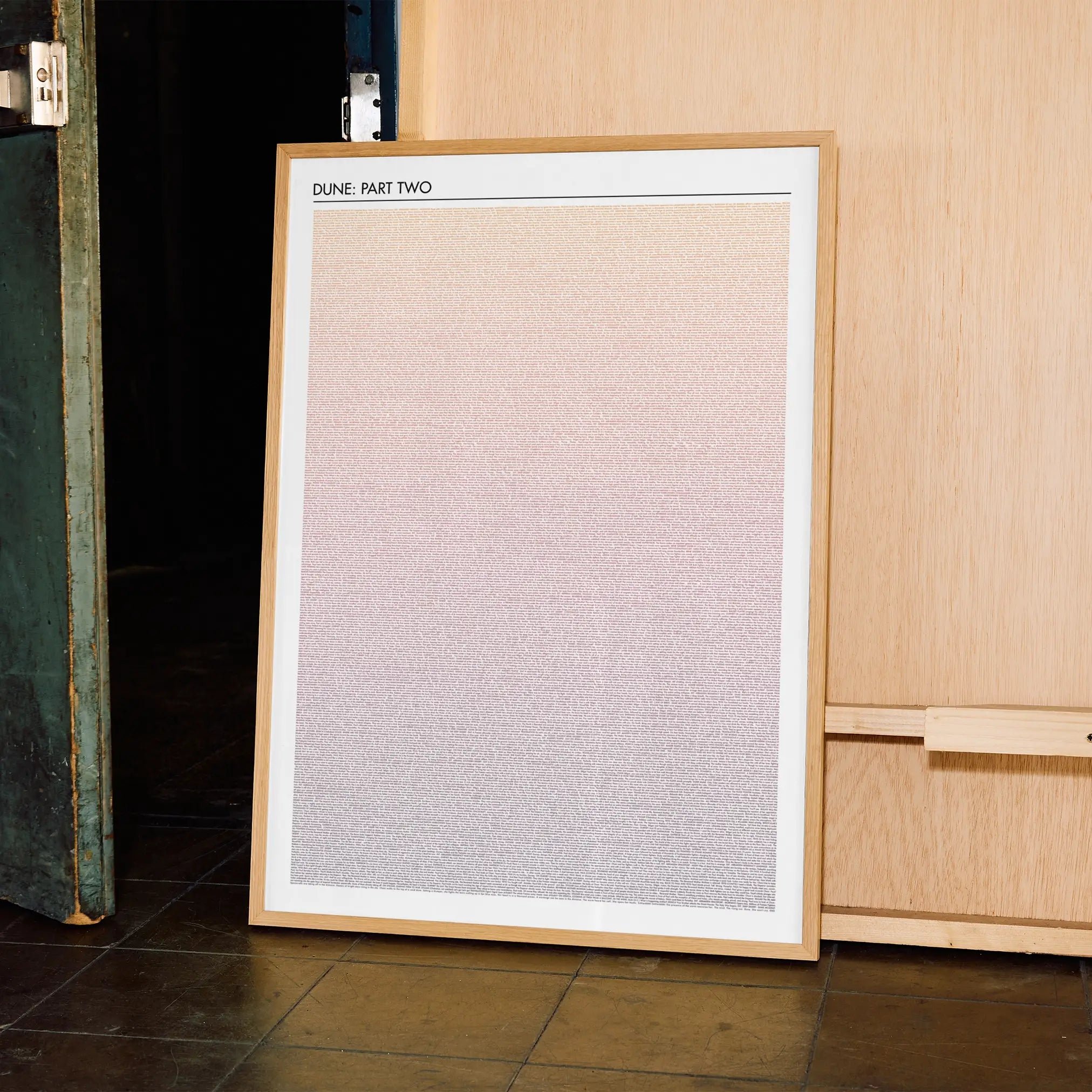 A framed Dune: Part Two movie script poster displayed in a contemporary interior setting.